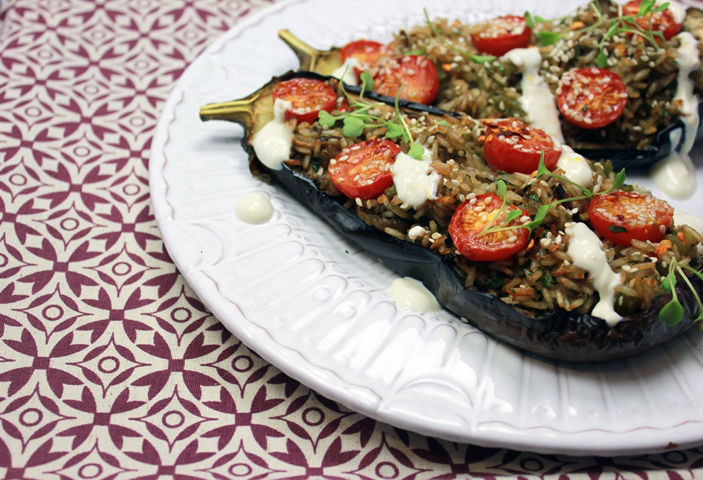 Aubergine stuffed with brown rice and cherry tomatoes