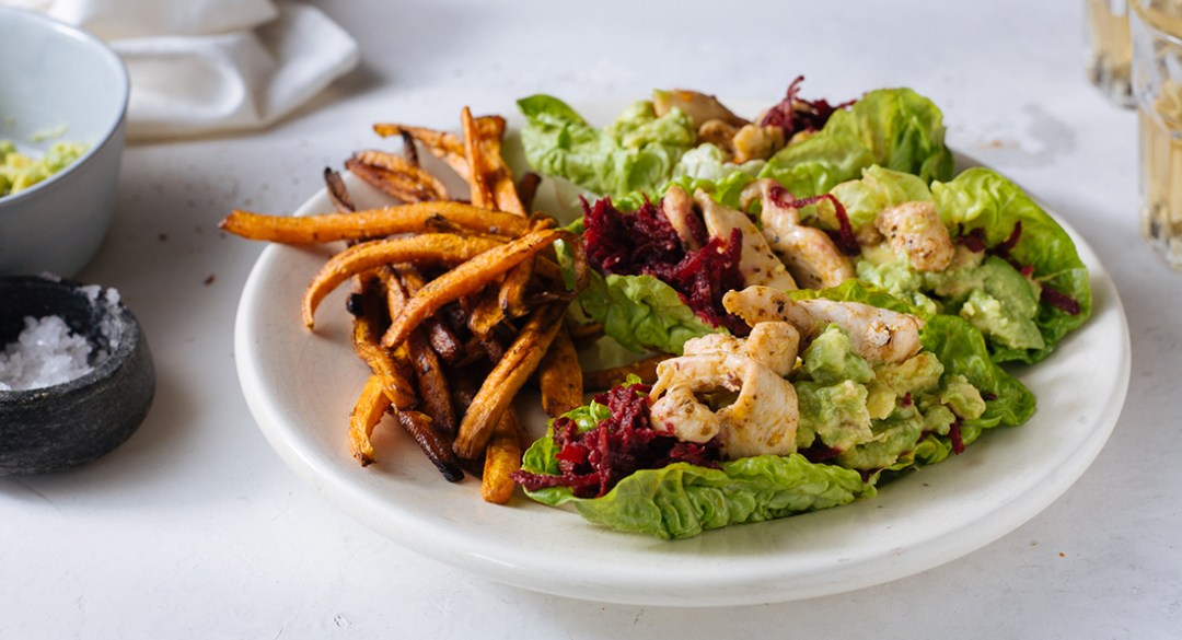Cajun chicken and lettuce tacos with carrot fries