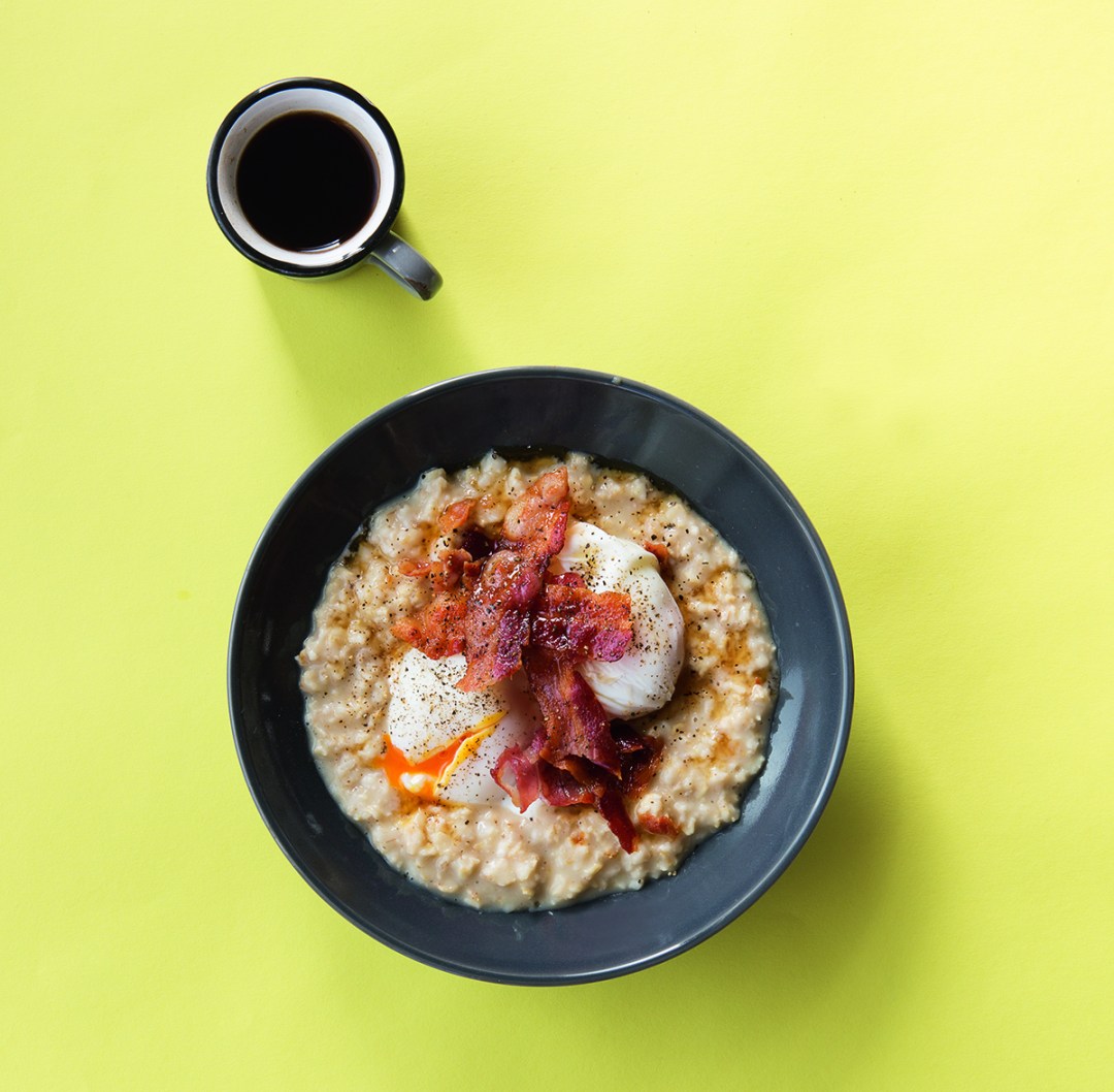 Oats, rye, and wheat with poached eggs, crispy bacon and maple syrup